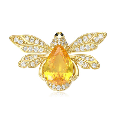 Two colorways of teardrop crystal bee brooch with four clear stone wings shown side by side.