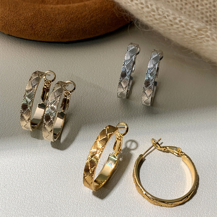 Textured Crossover Hoop Earrings In Polished Gold Tone