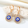Gold Tone Crystal Teardrop Evil Eye Necklace and Huggie Earrings view 2