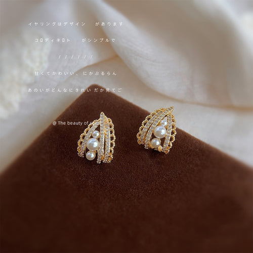 Gold-tone clear-stone-lace teardrop pearl studs in the first product display.