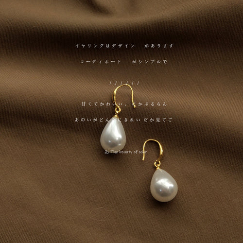 Gold-tone white-pearlescent-teardrop hook earrings in the first product display.