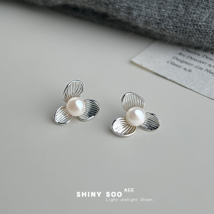 Silver Tone Ridged Three Petal Flower And White Pearl Stud Earrings