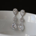 Three Stone Crystal Drop Earrings in Polished Metal view 2