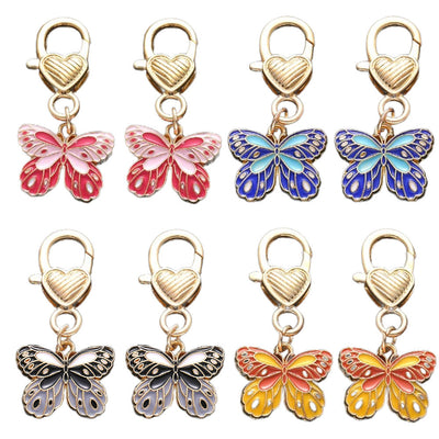 Front product photo of butterfly and heart lobster clasp charm showing the pictured design arrangement