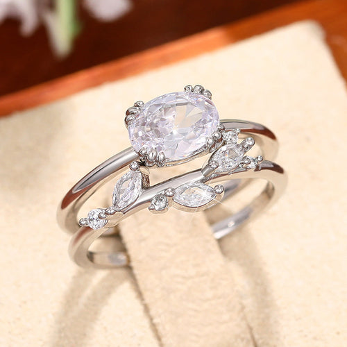 Display view of silver tone round crystal leaf branch double ring polished metal jewelry