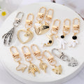 Gold and Silver Tone Assorted Symbol and Character Clip Keychains view 1