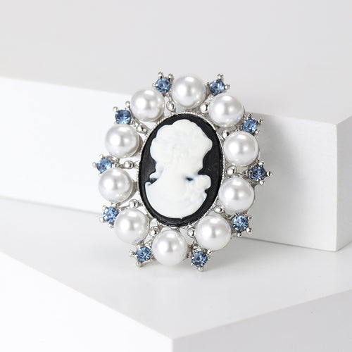 Cameo pearl brooch close angled view on white display