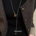 Silver Tone Chain Necklace with Brown Vase Pendant view 1