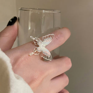 Two Silver Tone Butterfly Open Rings With Translucent Or Blue Crystal Wings