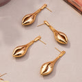 Sculptural Open Shell Drop Earrings in Gold and Silver Tone view 3