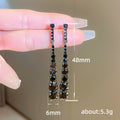 Long Linear Crystal Drop Earrings in Black and Silver view 5