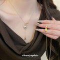 Gold Tone Heart Lock Pendant Necklace with Small Crystal Accents view 1