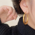 Gold Tone Braided Raised Texture Medium Hoop Earrings view 4