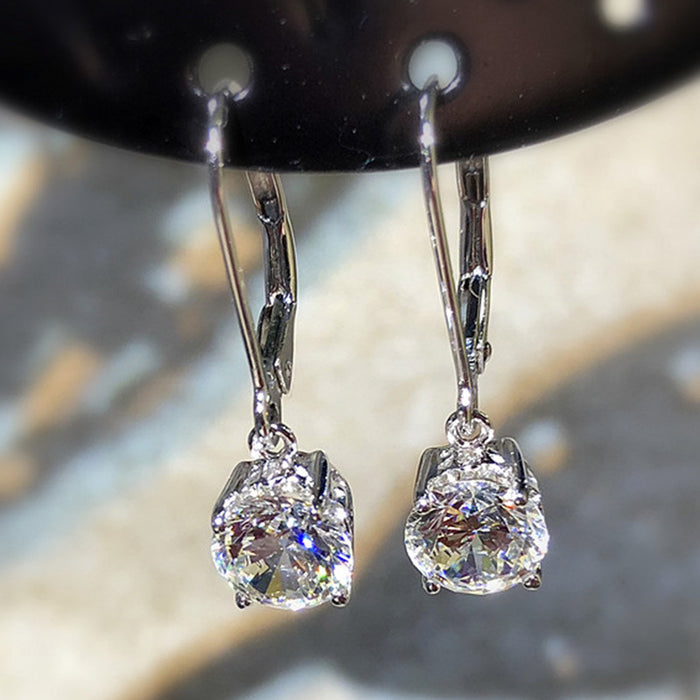 Round Clear Solitaire Leverback Drop Earrings In Silver Tone