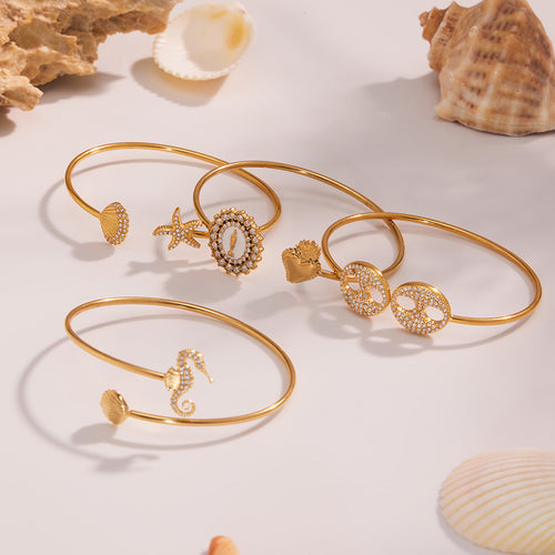 Display view of sea life open bangles in main image 2.