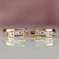 Gold Tone Four Stone Cross Band Huggie Hoop Earrings view 3