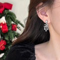 Star Bow Tassel Stud Earrings In Gold And Silver With Decorative Metal Details view 4