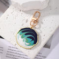 Gold Tone Irregular Round Marbled Swirl Clip Keychains in Six Colors view 7