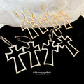 Open Cross Hoop Earrings in Gold and Silver with Polished Metal Details view 2