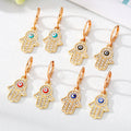 Gold and Silver Tone Pavé Crystal Hamsa Evil Eye Huggie Earrings view 1