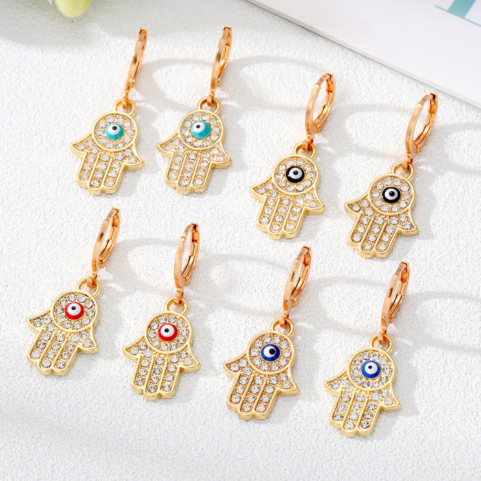 Gold and Silver Tone Pavé Crystal Hamsa Evil Eye Huggie Earrings
