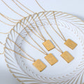 Gold Rectangular Pendant Necklace Abstract Face Line Engraving view 2