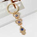 Gold Rhinestone Evil Eye Keychain With Butterfly And Hamsa Charm view 2