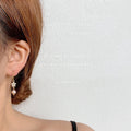 Gold Tone Clear Stone Snowflake And Pink Pearl Hook Earrings view 2