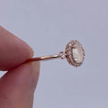 Pale Pink Oval Cabochon Halo Ring In Polished Rose Tone view 5