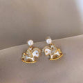 Rocking Horse Pearl Stud Earrings In Gold And Silver view 7