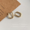 Polished Oval Huggie Hoop Earrings Gold and Silver view 4