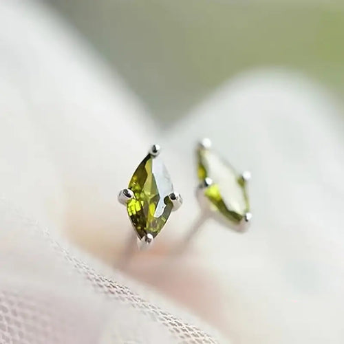 Second product view showing green marquise solitaire stud earrings in two metal tones