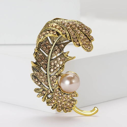 Curled Crystal Feather Brooch with Faux Pearl Accent angled display view