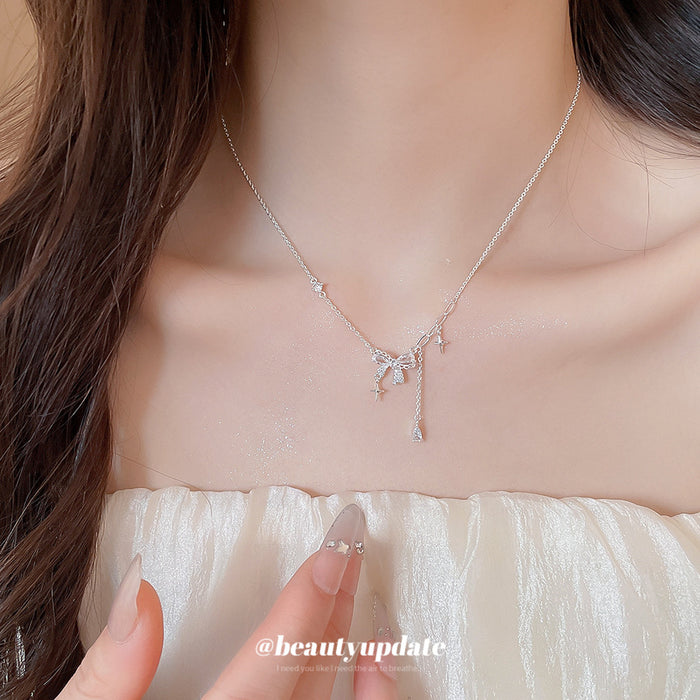 Silver Tone Bow and Cross Charm Draped Necklace Fashion Jewelry