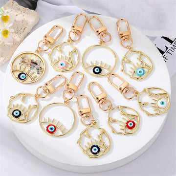 Gold Tone Irregular Openwork and Lash Evil Eye Clip Keychains