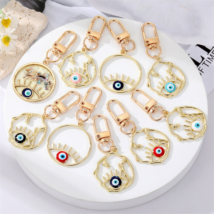Gold Tone Irregular Openwork and Lash Evil Eye Clip Keychains