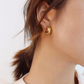 Crossed Twist C-Shape Hoop Earrings In Gold Or Silver Tone view 3