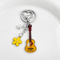 Guitar Shaped Charm Keychain With Star And Flower Pendants view 10