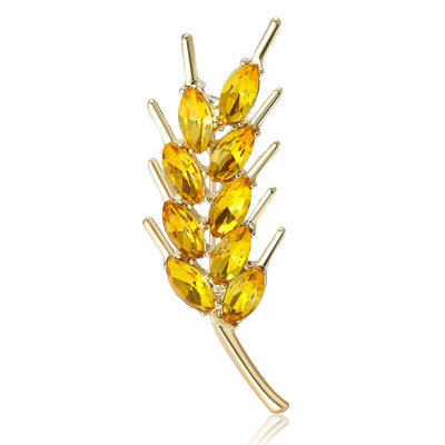 Yellow crystal wheat ear brooch upright on white background