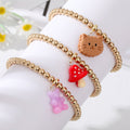 Gold Tone Beaded Gummy Bear Mushroom Cat and Cow Charm Bracelets view 2