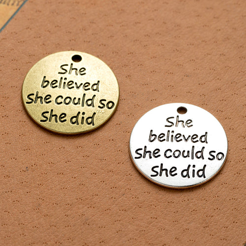 Main product image of the she believed quote coin charm showing a round tag engraved She believed she could so she did