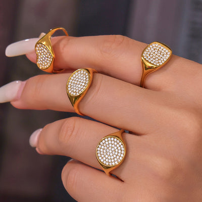 Styled hand view of geometric solitaire crystal rings in main image 1.
