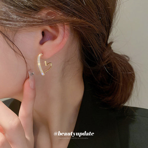 Gold Tone Crystal Open Heart Statement Hoop Stud Earrings shown in arranged product view