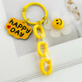 Smiley Daisy Charm Keychain with Acrylic Chain and Happy Day Tag view 4