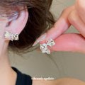 Crystal Bow Stud Earrings in Gold and Silver Tones view 4