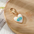 Gold Tone Evil Eye Heart Charms with Large Lobster Clasps in Six Designs view 3