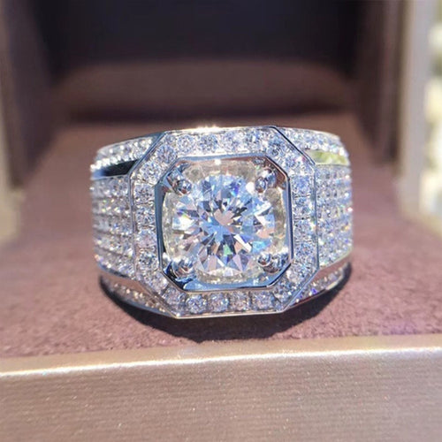 Product view showing silver-tone round clear center square-frame wide signet ring