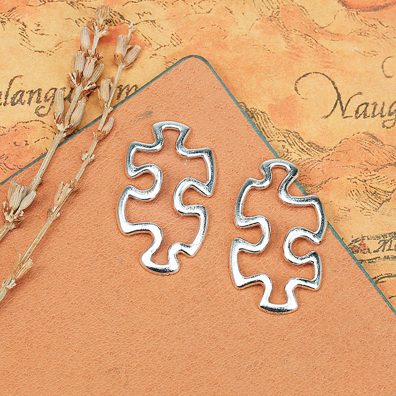 30x18mm Hollow Curved Puzzle Alloy Charm Pendant