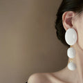White Oval Cascade Statement Drop Earrings For Distinctive Statement Styling view 2
