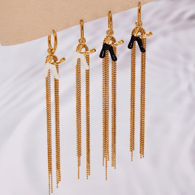 Display view of enamel letter K multi chain tassel earrings in main image 1.